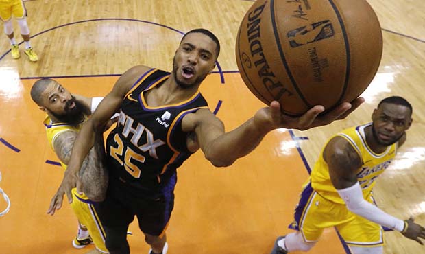 Phoenix Suns forward Mikal Bridges (25) shoots over Los Angeles Lakers center Tyson Chandler, left,...