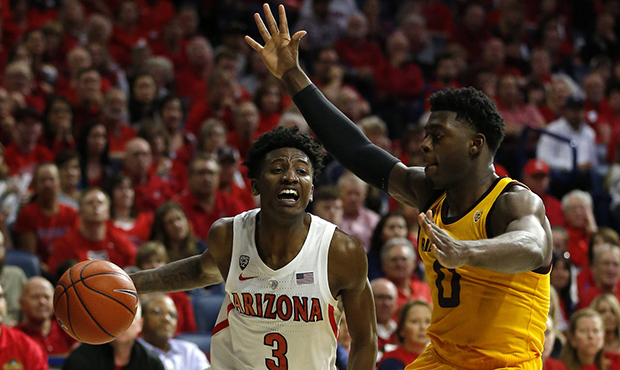Arizona guard Dylan Smith (3) drives on Arizona State guard Luguentz Dort in the second half during...