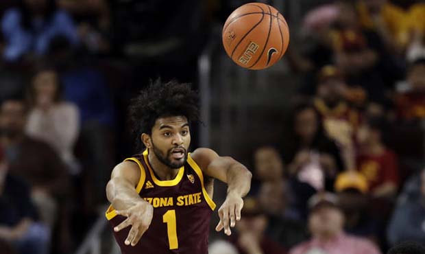 Arizona State guard Remy Martin (1) passes as he is pressured by Southern California defenders duri...