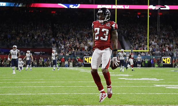 Atlanta Falcons' Robert Alford celebrates after scoring a touchdown during the first half of the NF...