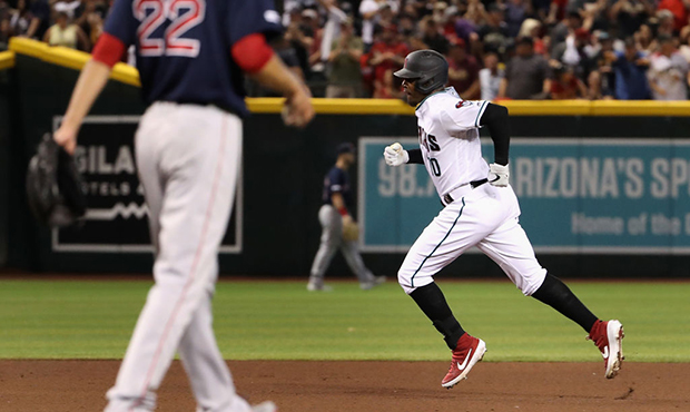 Adam Jones #10 of the Arizona Diamondbacks rounds the bases after hitting a solo home-run against t...