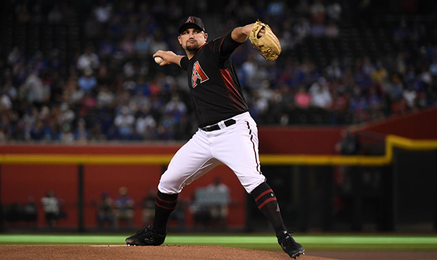 Zack Godley #52 of the Arizona Diamondbacks delivers a first inning pitch against the Chicago Cubs ...