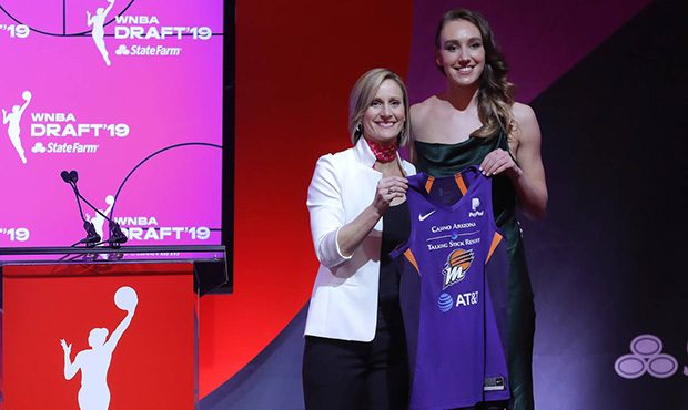Stanford's Alanna Smith, right, poses for a photo with WNBA COO Christy Hedgpeth after being select...
