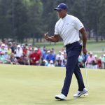 Tiger Woods fist-pumps as he birdies the ninth hole during the second round of the Masters golf tournament at Augusta National Golf Club, Friday, April 12, 2019, in Augusta, Ga. (Curtis Compton/Atlanta Journal-Constitution via AP)