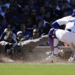 Arizona Diamondbacks' Christian Walker, left, scores against Chicago Cubs catcher Willson Contreras during the sixth inning of a baseball game Saturday, April 20, 2019, in Chicago. (AP Photo/Nam Y. Huh)