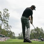 Ian Poulter, of England, hits from the 14th tee during the second round for the Masters golf tournament Friday, April 12, 2019, in Augusta, Ga. (AP Photo/David J. Phillip)