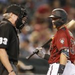 Arizona Diamondbacks Nick Ahmed (13) talks with umpire Mike Winters after striking out against the San Diego Padres in the second inning during a baseball game, Sunday, April 14, 2019, in Phoenix. (AP Photo/Rick Scuteri)