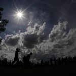 Brooks Koepka walks up the 18th hole during the second round for the Masters golf tournament Friday, April 12, 2019, in Augusta, Ga. (AP Photo/Charlie Riedel)