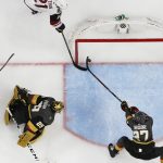 Arizona Coyotes center Derek Stepan (21) scores against Vegas Golden Knights goaltender Marc-Andre Fleury as Shea Theodore helps on defense during the second period of an NHL hockey game Thursday, April 4, 2019, in Las Vegas. (AP Photo/John Locher)