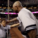 
              New York Yankees starting pitcher CC Sabathia hugs his son Carter after throwing his 3,000th career strikeout, during the second inning of the team's baseball game against the Arizona Diamondbacks, Tuesday, April 30, 2019, in Phoenix. (AP Photo/Matt York)
            