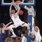 Texas forward Dylan Osetkowski (21) dunks during the second half of the championship basketball game in the National Invitational Tournament against Lipscomb, Thursday, April 4, 2019, at Madison Square Garden in New York. Texas won 81-66. (AP Photo/Mary Altaffer)