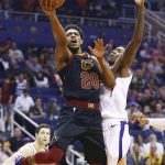 Cleveland Cavaliers guard Brandon Knight (20) drives to the basket against Phoenix Suns guard Jamal Crawford, right, during the first half of an NBA basketball game Monday, April 1, 2019, in Phoenix. (AP Photo/Ross D. Franklin)