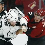 Arizona Coyotes left wing Lawson Crouse (67) and Los Angeles Kings left wing Kyle Clifford (13) fight during the first period of an NHL hockey game, Tuesday, April 2, 2019, in Glendale, Ariz. (AP Photo/Ross D. Franklin)