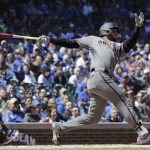 Arizona Diamondbacks' David Peralta hits a solo home run against the Chicago Cubs during the first inning of a baseball game Saturday, April 20, 2019, in Chicago. (AP Photo/Nam Y. Huh)