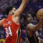 Phoenix Suns forward Josh Jackson drives past New Orleans Pelicans guard Kenrich Williams (34) during the second half of an NBA basketball game Friday, April 5, 2019, in Phoenix. The Suns defeated the Pelicans 133-126 in overtime. (AP Photo/Rick Scuteri)