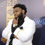 Clemson defensive tackle Christian Wilkins walks the red carpet ahead of the first round at the NFL football draft, Thursday, April 25, 2019, in Nashville, Tenn. (AP Photo/Mark Humphrey)