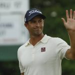 Adam Scott, of Australia, waves as he walks off the 18th green during the second round for the Masters golf tournament Friday, April 12, 2019, in Augusta, Ga. (AP Photo/Matt Slocum)
