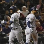 San Diego Padres' Manuel Margot, left, celebrates his home run against the Arizona Diamondbacks with Fernando Tatis Jr. during the eighth inning of a baseball game Thursday, April 11, 2019, in Phoenix. The Padres won 7-6. (AP Photo/Ross D. Franklin)