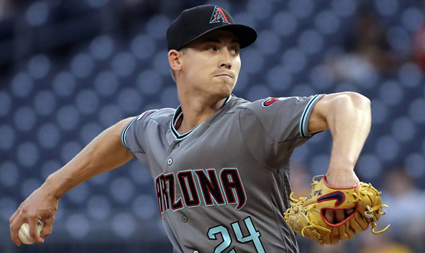 Arizona Diamondbacks starting pitcher Luke Weaver delivers in the first inning of a baseball game a...