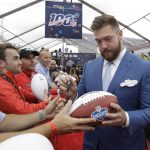 Alabama tackle Jonah Williams signs an autograph as he walks the red carpet ahead of the first round at the NFL football draft, Thursday, April 25, 2019, in Nashville, Tenn. (AP Photo/Steve Helber)