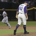 Arizona Diamondbacks starting pitcher Zack Godley (52) pauses on the mound after giving up a three-run home run to San Diego Padres Austin Hedges, left, during the sixth inning of a baseball game Thursday, April 11, 2019, in Phoenix. (AP Photo/Ross D. Franklin)