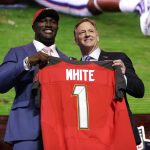 Louisiana State linebacker Devin White poses with NFL Commissioner Roger Goodell after the Tampa Bay Buccaneers selected White in the first round at the NFL football draft, Thursday, April 25, 2019, in Nashville, Tenn. (AP Photo/Mark Humphrey)