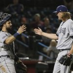 San Diego Padres relief pitcher Trey Wingenter, right, and catcher Austin Hedges celebrate the final out of the team's baseball game against the Arizona Diamondbacks on Thursday, April 11, 2019, in Phoenix. The Padres won 7-6. (AP Photo/Ross D. Franklin)