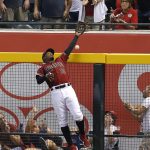 Arizona Diamondbacks right fielder Adam Jones can not make the catch on a home run ball hit by Boston Red Sox's Mitch Moreland in the seventh inning during a baseball game, Sunday, April 7, 2019, in Phoenix. (AP Photo/Rick Scuteri)
