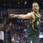 Utah Jazz forward Joe Ingles winks at Jazz fans in the front row after making a 3-pointer against the Phoenix Suns during the second half of an NBA basketball Wednesday, April 3, 2019, in Phoenix. The Jazz won 118-97. (AP Photo/Ross D. Franklin)
