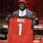 Louisiana State linebacker Devin White poses with his new jersey after the Tampa Bay Buccaneers selected White in the first round at the NFL football draft, Thursday, April 25, 2019, in Nashville, Tenn.(AP Photo/Steve Helber)
