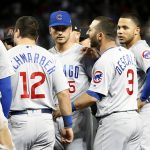 Chicago Cubs' Daniel Descalso (3) is restrained by teammate Albert Almora (5) as he exchanges words with Arizona Diamondbacks players after the benches cleared when Cubs batter David Bote was hit by a pitch during the seventh inning of a baseball game, Saturday, April 27, 2019, in Phoenix. (AP Photo/Ralph Freso)