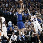 Phoenix Suns' Troy Daniels (30) watches as forward Ray Spalding (26) defends against a shot by Dallas Mavericks' Dirk Nowitzki (41) during the first half of an NBA basketball game in Dallas, Tuesday, April 9, 2019. (AP Photo/Tony Gutierrez)
