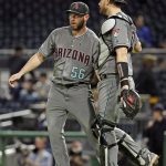 Arizona Diamondbacks relief pitcher Greg Holland (56) celebrates with catcher Carson Kelly after getting the final out of a 2-1 win over the Pittsburgh Pirates in a baseball game in Pittsburgh, Tuesday, April 23, 2019. (AP Photo/Gene J. Puskar)
