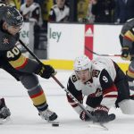 Vegas Golden Knights center Ryan Carpenter (40) and Arizona Coyotes center Clayton Keller (9) vie for the puck during the first period of an NHL hockey game Thursday, April 4, 2019, in Las Vegas. (AP Photo/John Locher)