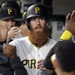 Pittsburgh Pirates' Colin Moran, center, celebrates as he returns to the dugout after scoring on a single by Elias Diaz off Arizona Diamondbacks starting pitcher Zack Godley during the third inning of a baseball game in Pittsburgh, Monday, April 22, 2019. (AP Photo/Gene J. Puskar)