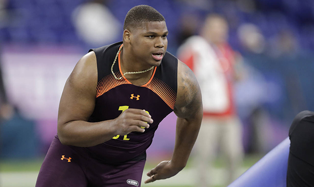 Alabama defensive lineman Quinnen Williams runs a drill during the NFL football scouting combine, S...
