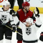 Los Angeles Kings left wing Kyle Clifford (13) celebrates his goal as Kings defenseman Dion Phaneuf, left, and Arizona Coyotes defenseman Jason Demers, top right, look for the puck during the second period of an NHL hockey game Tuesday, April 2, 2019, in Glendale, Ariz. (AP Photo/Ross D. Franklin)