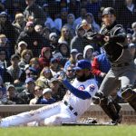 Chicago Cubs' Jason Heyward, left, is forced out at home plate by Arizona Diamondbacks catcher Caleb Joseph, right, during the second inning of a baseball game, Friday, April 19, 2019, in Chicago. (AP Photo/David Banks)