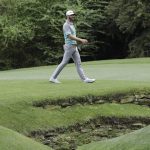 Dustin Johnson walks to the 13th green during the second round for the Masters golf tournament Friday, April 12, 2019, in Augusta, Ga. (AP Photo/David J. Phillip)