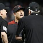 Arizona Diamondbacks manager Torey Lovullo, center, argues with home plate umpire Bill Welke, right, after a warning was issued to both benches after Chicago Cubs batter David Bote was hit by a pitch during the seventh inning of a baseball game, Saturday, April 27, 2019, in Phoenix. (AP Photo/Ralph Freso)
