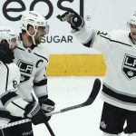 Los Angeles Kings defenseman Drew Doughty (8) celebrates his empty-net goal against the Arizona Coyotes with Kings center Anze Kopitar, middle, and right wing Dustin Brown (23) during the third period of an NHL hockey game, Tuesday, April 2, 2019, in Glendale, Ariz. The Kings defeated the Coyotes 3-1. (AP Photo/Ross D. Franklin)