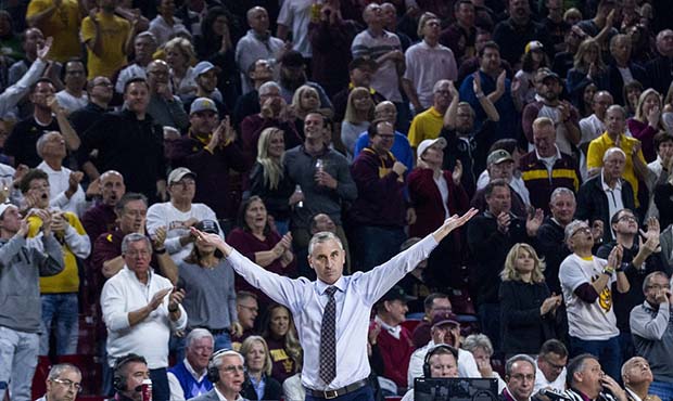 Arizona State coach Bobby Hurley gestures to the crowd during the second half of the team's NCAA co...