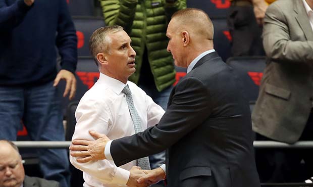 Head coach Bobby Hurley of the Arizona State Sun Devils shakes hands with head coach Chris Mullin o...