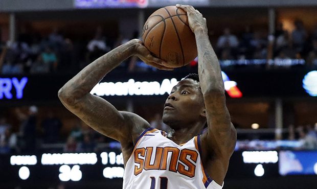 Phoenix Suns guard Jamal Crawford shoots during the first half of the team's NBA basketball game ag...