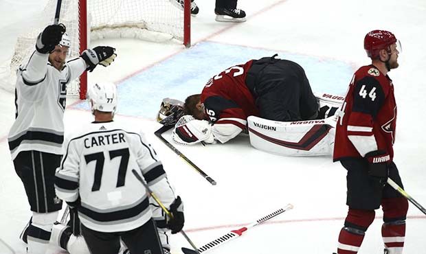 Los Angeles Kings left wing Kyle Clifford, left, celebrates a goal by Kings' Trevor Lewis with King...