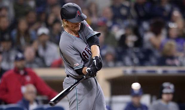 Arizona Diamondbacks' Zack Greinke hits a three-run home run during the fourth inning of a baseball...