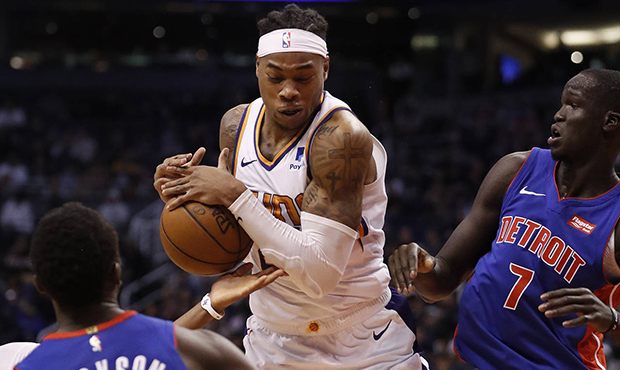 Phoenix Suns forward Richaun Holmes pulls down a rebound as Detroit Pistons forward Thon Maker (7) ...