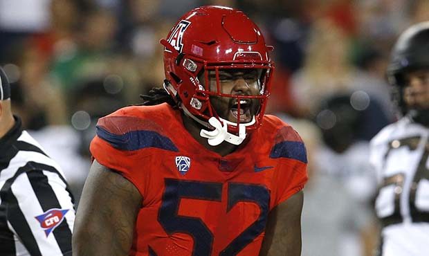 Arizona defensive tackle PJ Johnson (52) reacts after making a tackle for a loss against Oregon in ...