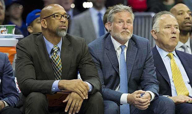 Assistant coach Monty Williams and head coach Brett Brown of the Philadelphia 76ers look on against...