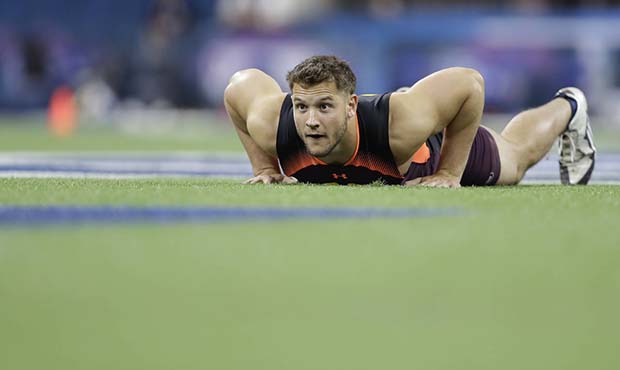 Ohio State defensive lineman Nick Bosa runs a drill during the NFL football scouting combine, Sunda...